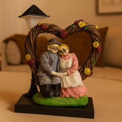 Elderly Couple Showpiece Under Heart Arch