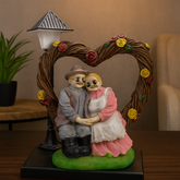 Elderly Couple Showpiece Under Heart Arch