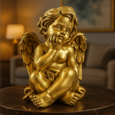 Gold angel statue on a table with a blurred indoor background