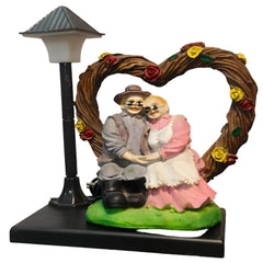 Elderly Couple Showpiece Under Heart Arch