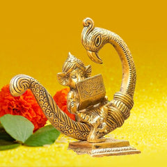 Sitting Baby Ganesh Idol Statue On Peacock with Book for Puja Ganesha Vastu Showpiece (15X7X15.5 cm, Gold), Medium