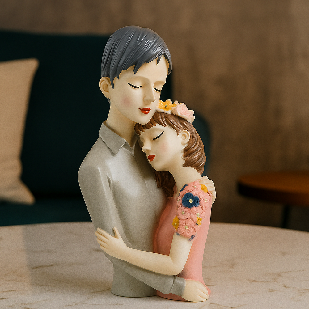 Statue of a man embracing a woman with flowers in their hair on a wooden surface.